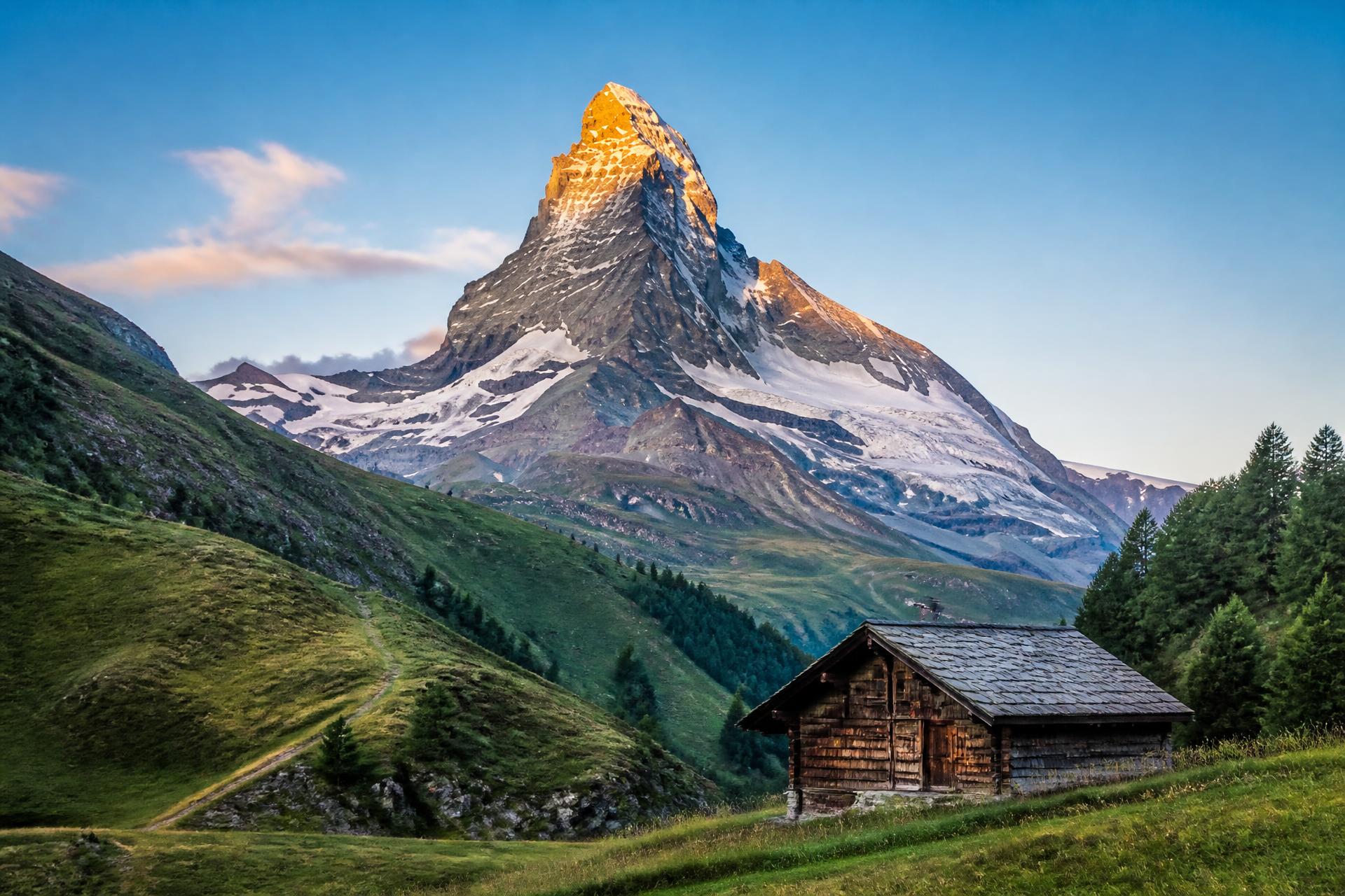 Snow-covered Alpine peaks above a quiet valley, Switzerland